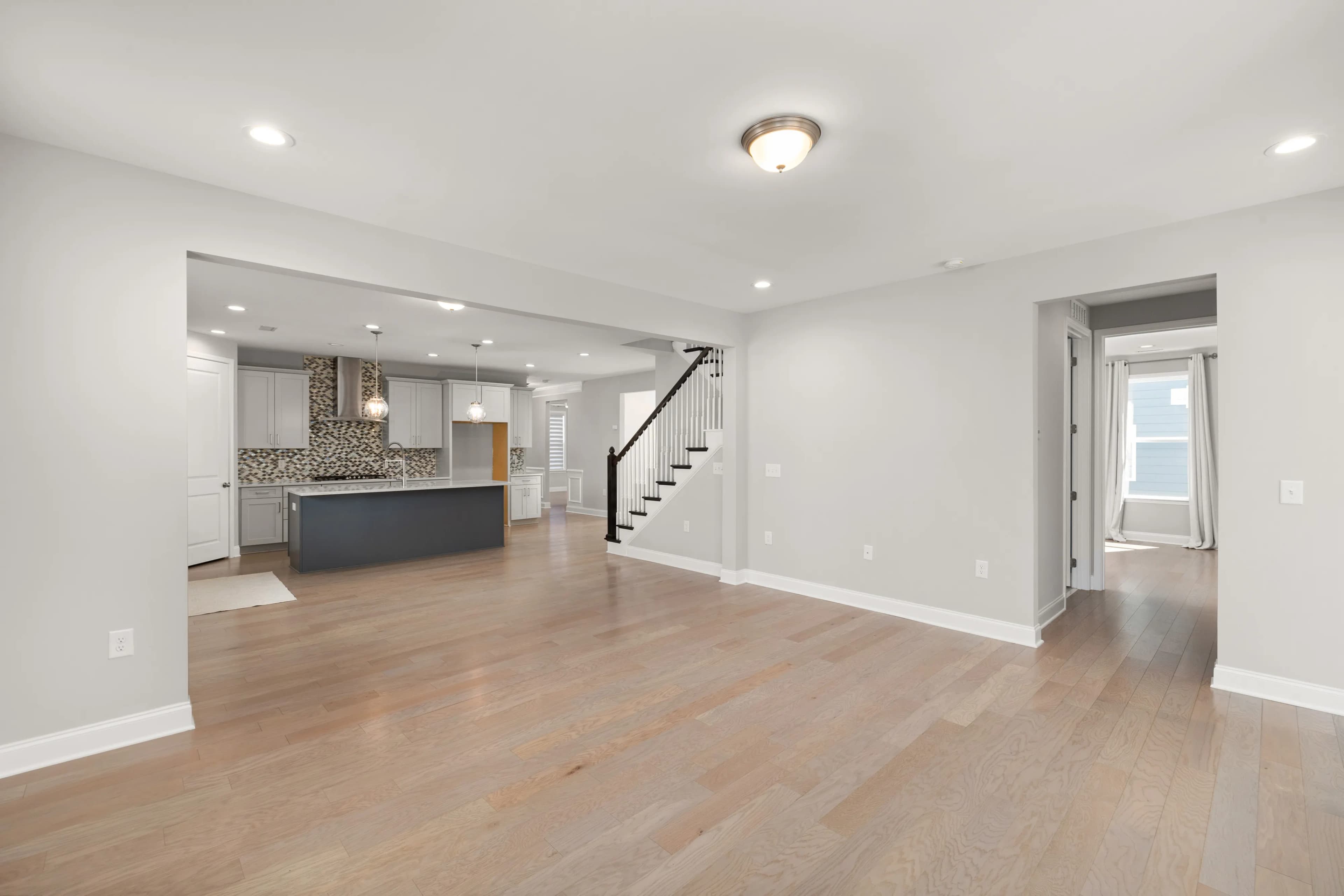 Open-plan kitchen and living with timber-look floor