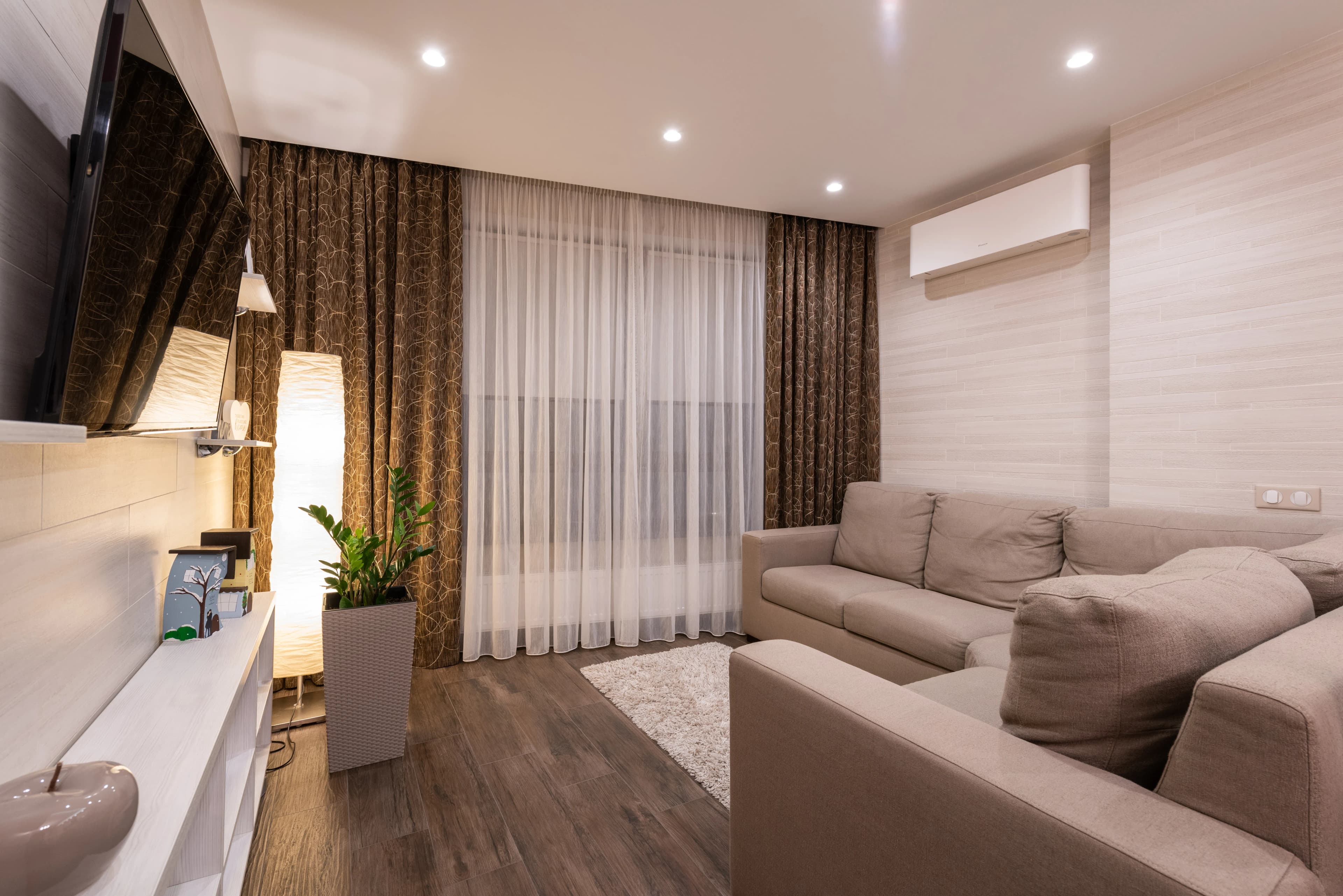 Living room with a timber-look floor and sofa